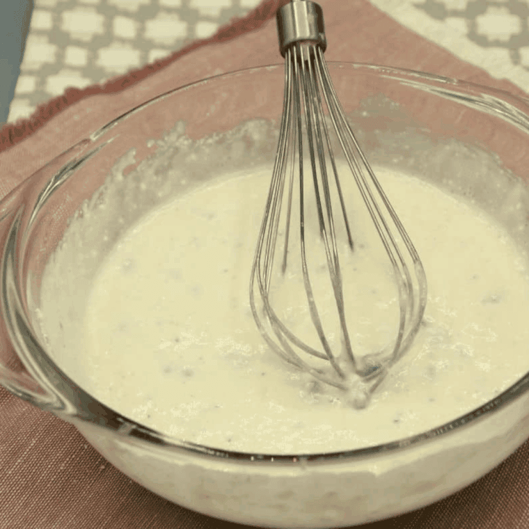 Mixing banana muffin mix, bananas, eggs, and milk