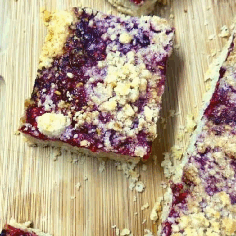 Freshly baked air fryer raspberry pie bars with golden crus