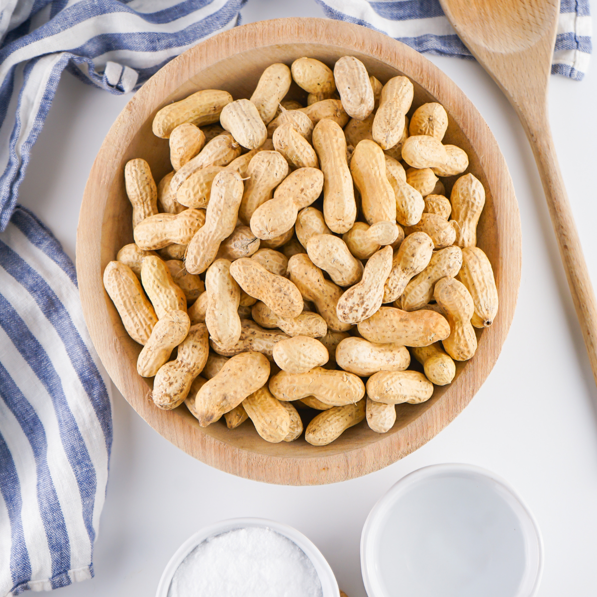 Ingredients needed for Easy Air Fryer Roasted Peanuts in the Shell on kitchen table.