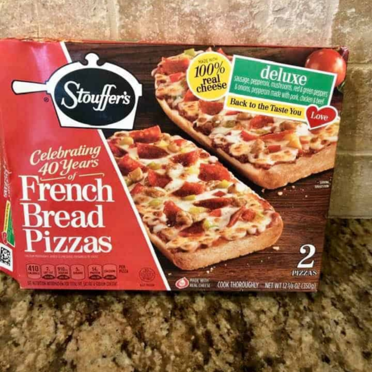 Frozen French bread pizza removed from packaging and kept frozen before air frying
