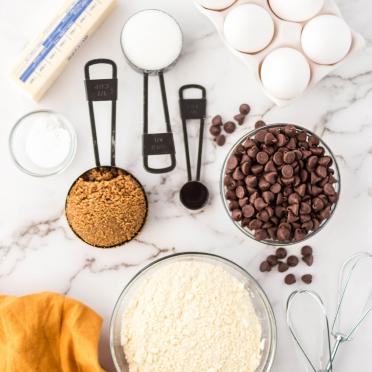 Ingredients for air fryer chocolate chip cookie pizza including flour, butter, sugar, egg, and chocolate chips