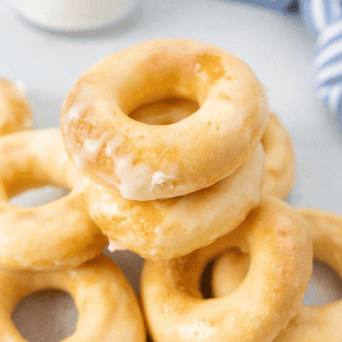 Homemade Dunkin Donuts copycat glazed donuts with shiny sweet glaze.