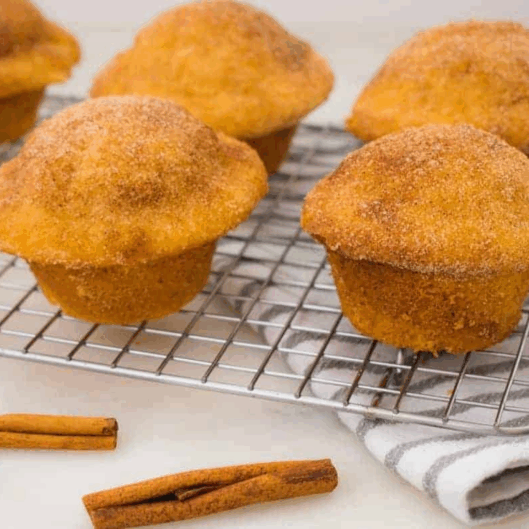 Golden air fryer cinnamon sugar muffins with soft centers and sweet, crunchy cinnamon topping, freshly baked and ready to enjoy.