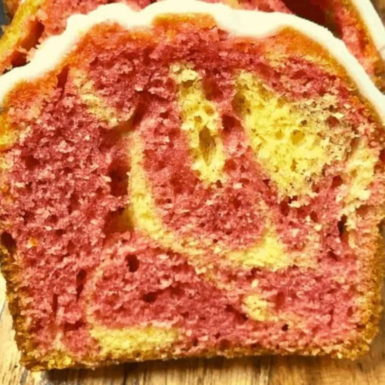 Lemon glaze drizzled over the cooled raspberry lemon bread