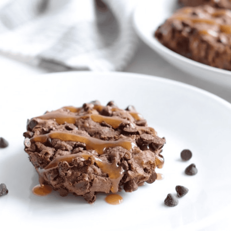 Plate of Air Fryer Salted Caramel Chocolate Chip Cookies with gooey caramel and melted chocolate chips.