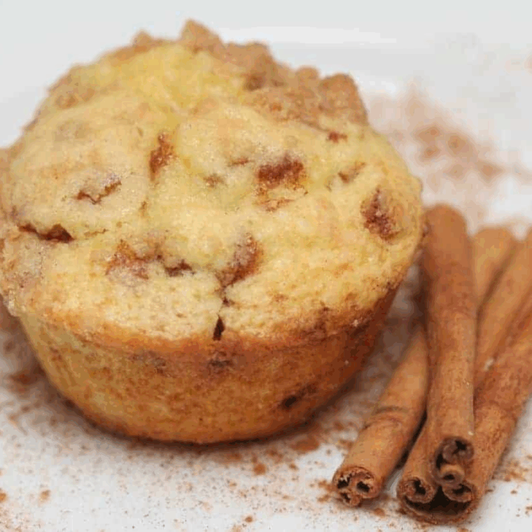 Golden-brown air fryer snickerdoodle muffins with a cinnamon-sugar topping, freshly baked and ready to enjoy.