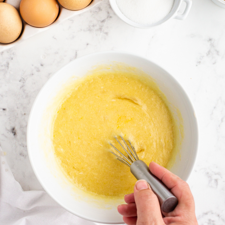 Butter and sugar creamed together in a mixing bowl until pale and fluffy