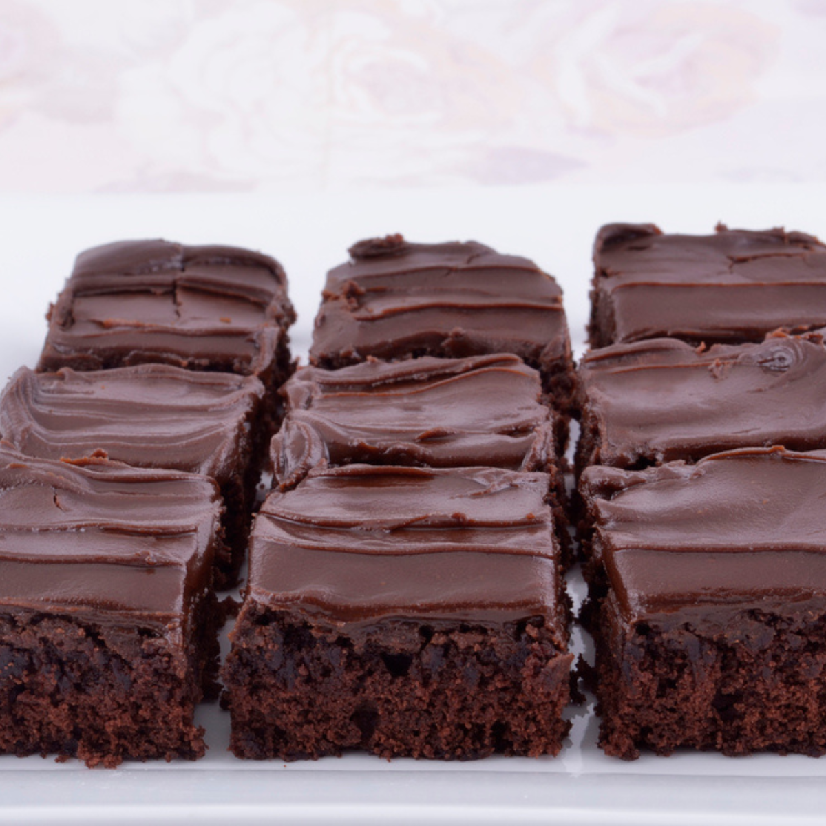 fudgy air fryer brownies with chocolate frosting on top