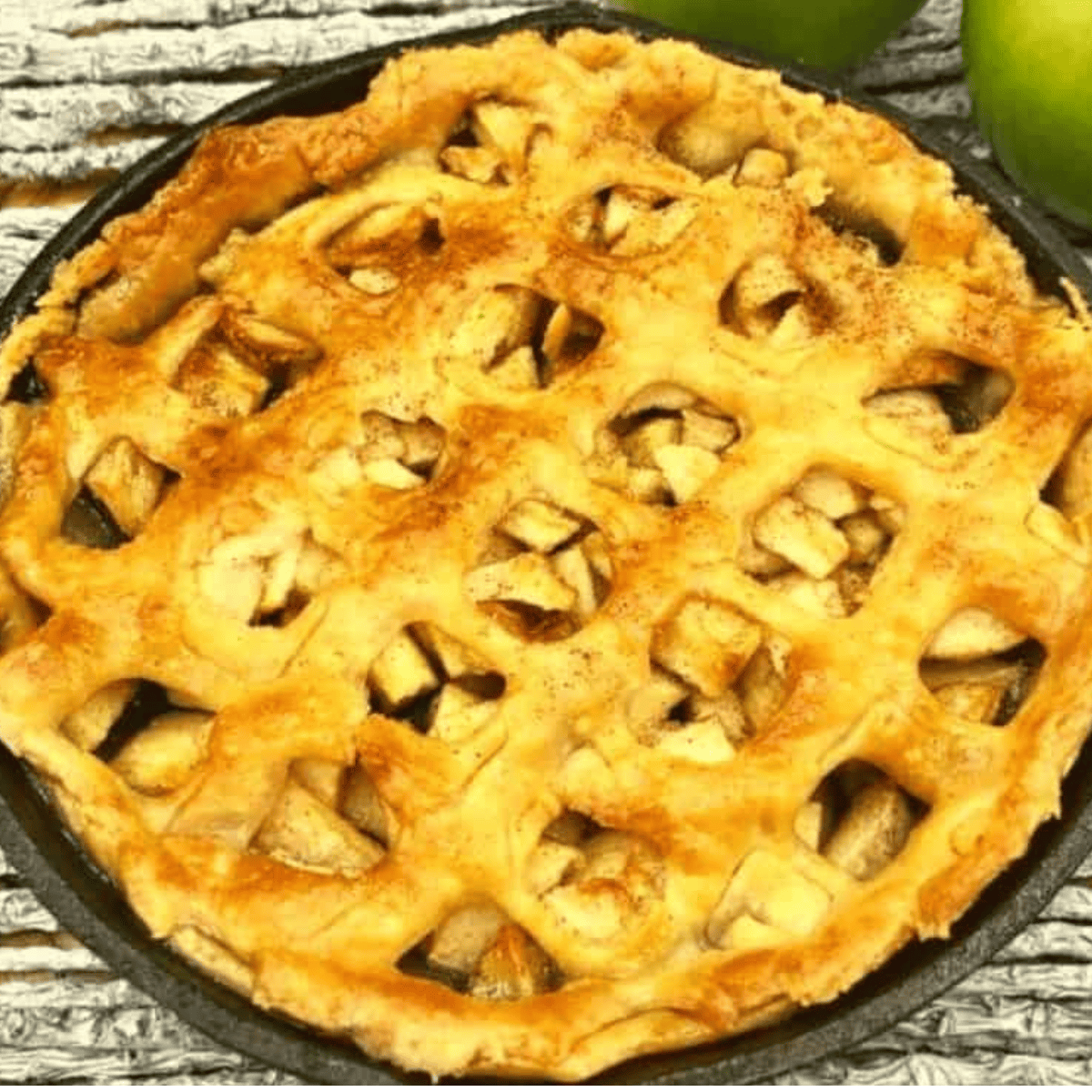 Golden air fryer apple pie with flaky crust and cinnamon-spiced apple filling.