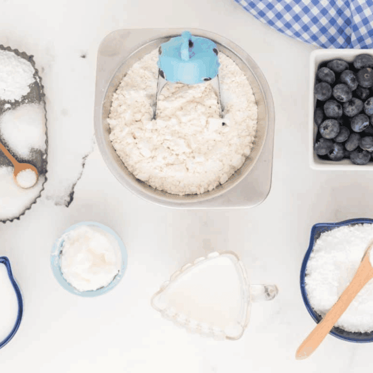 Ingredients needed for Easy Air Fryer Blueberry Biscuits on kitchen table.