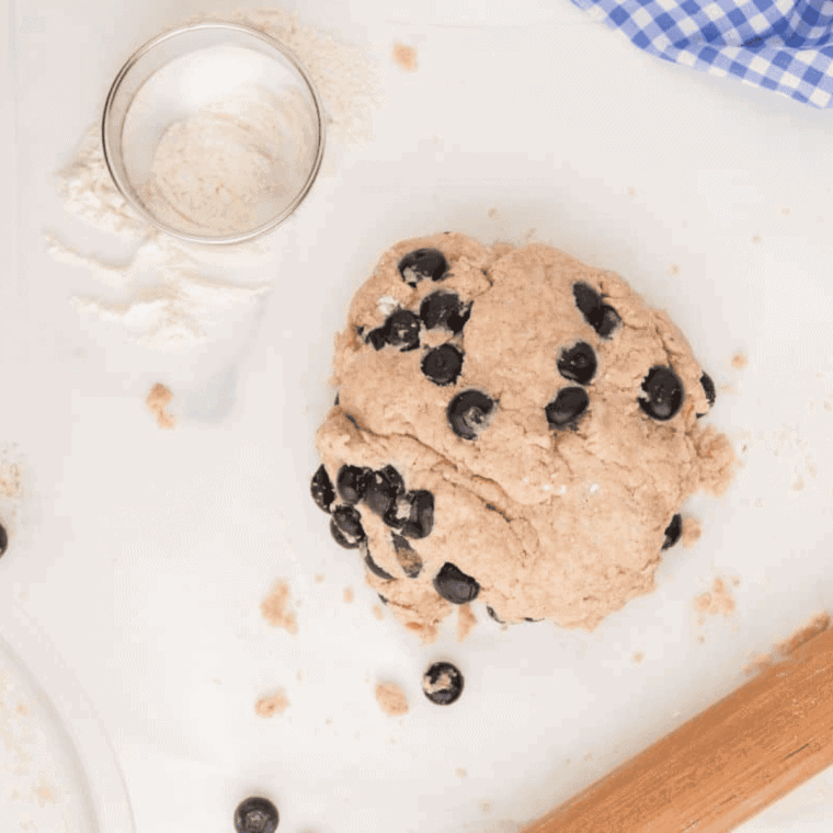 Cutting biscuits with a 2 3/4-inch cutter and arranging them in a greased air fryer, set to 350°F for 6–9 minutes.