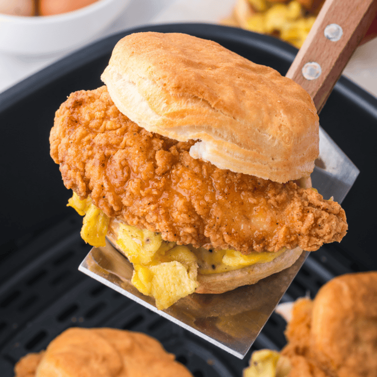 Golden homemade buttermilk biscuits cooked in an air fryer, showing fluffy layers and a buttery flaky texture.