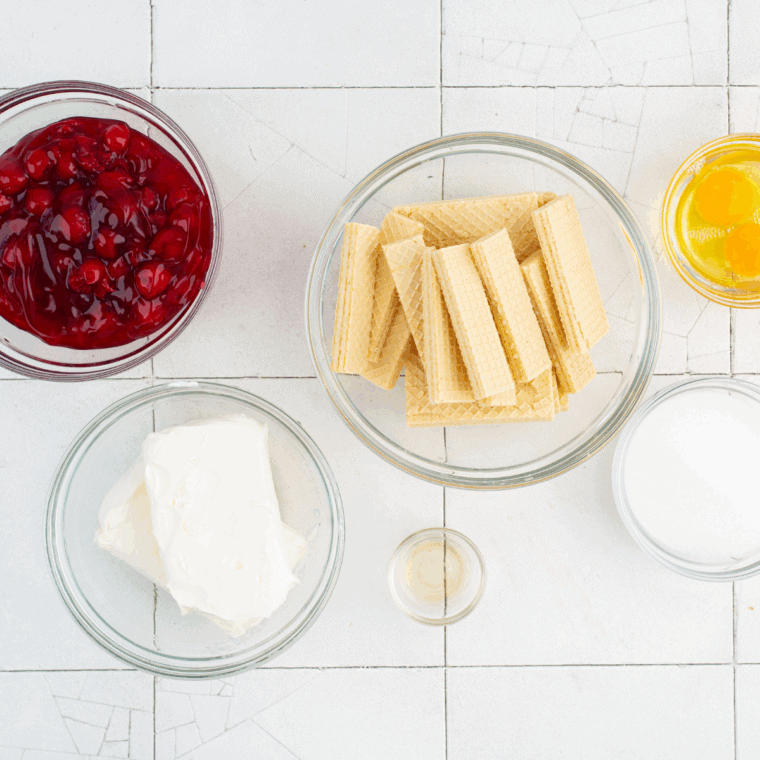 Ingredients needed for Air Fryer Mini Cheesecakes on kitchen table.