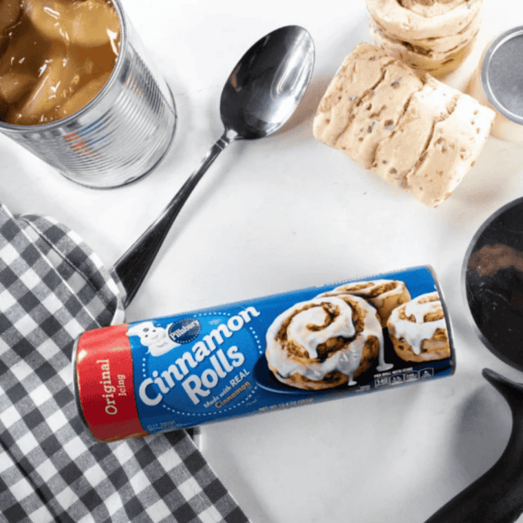 Ingredients for air fryer apple pie cups: a can of cinnamon rolls and apple pie filling