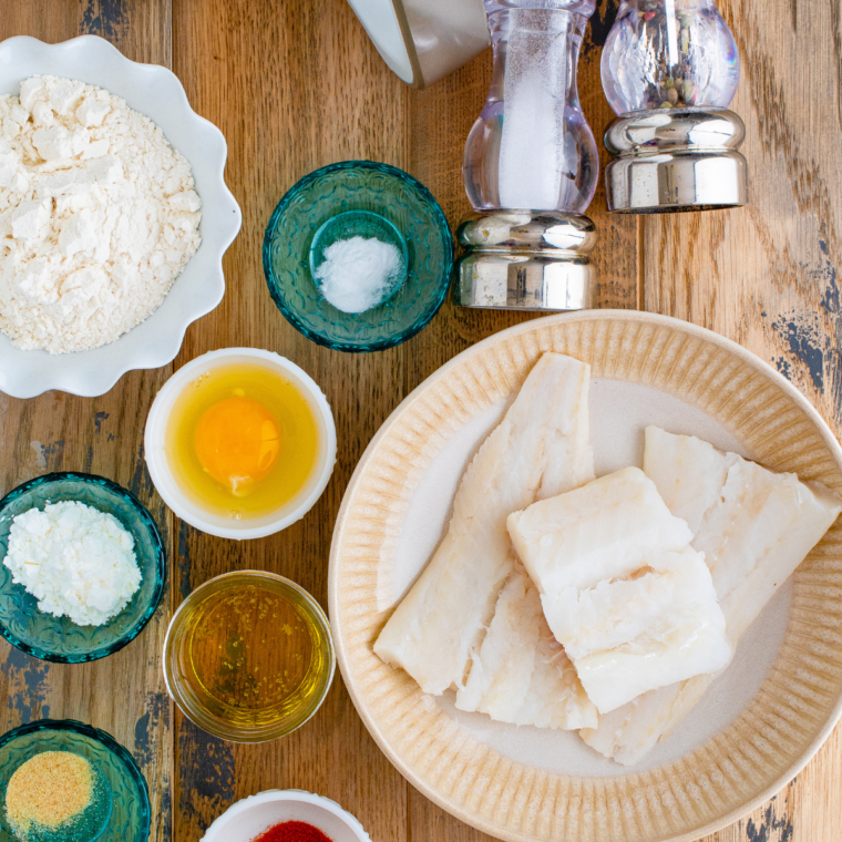 Ingredients for air fryer beer battered fish: cod, flour, beer, egg, and seasonings