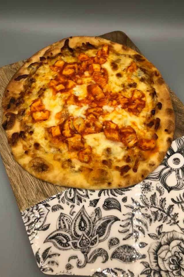 Air Fryer Naan Buffalo Chicken Pizza with spicy buffalo chicken and melted cheese