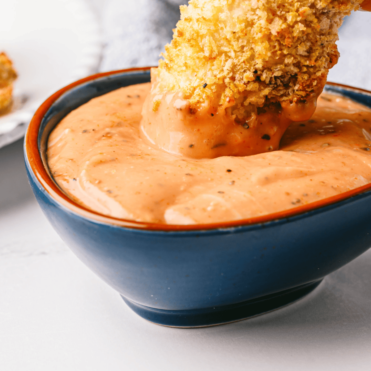 Small bowl of creamy, tangy copycat Zaxbys sauce ready for dipping chicken fingers
