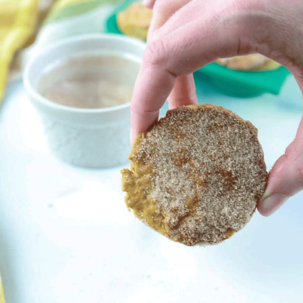 Close up of Air Fryer Cinnamon Sugar Donut Muffins on kitchen table.