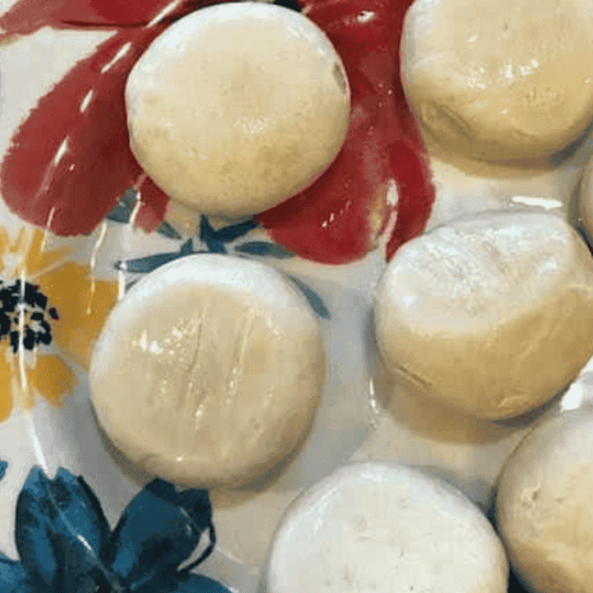Defrosted rolls on counter being cut into four pieces each
