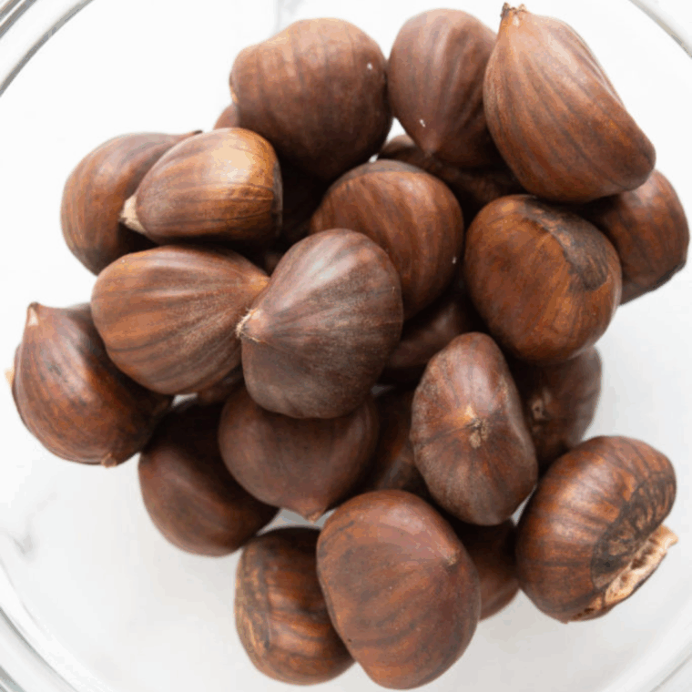 Ingredients needed for Easy Air Fryer Roasted Chestnuts on kitchen table.