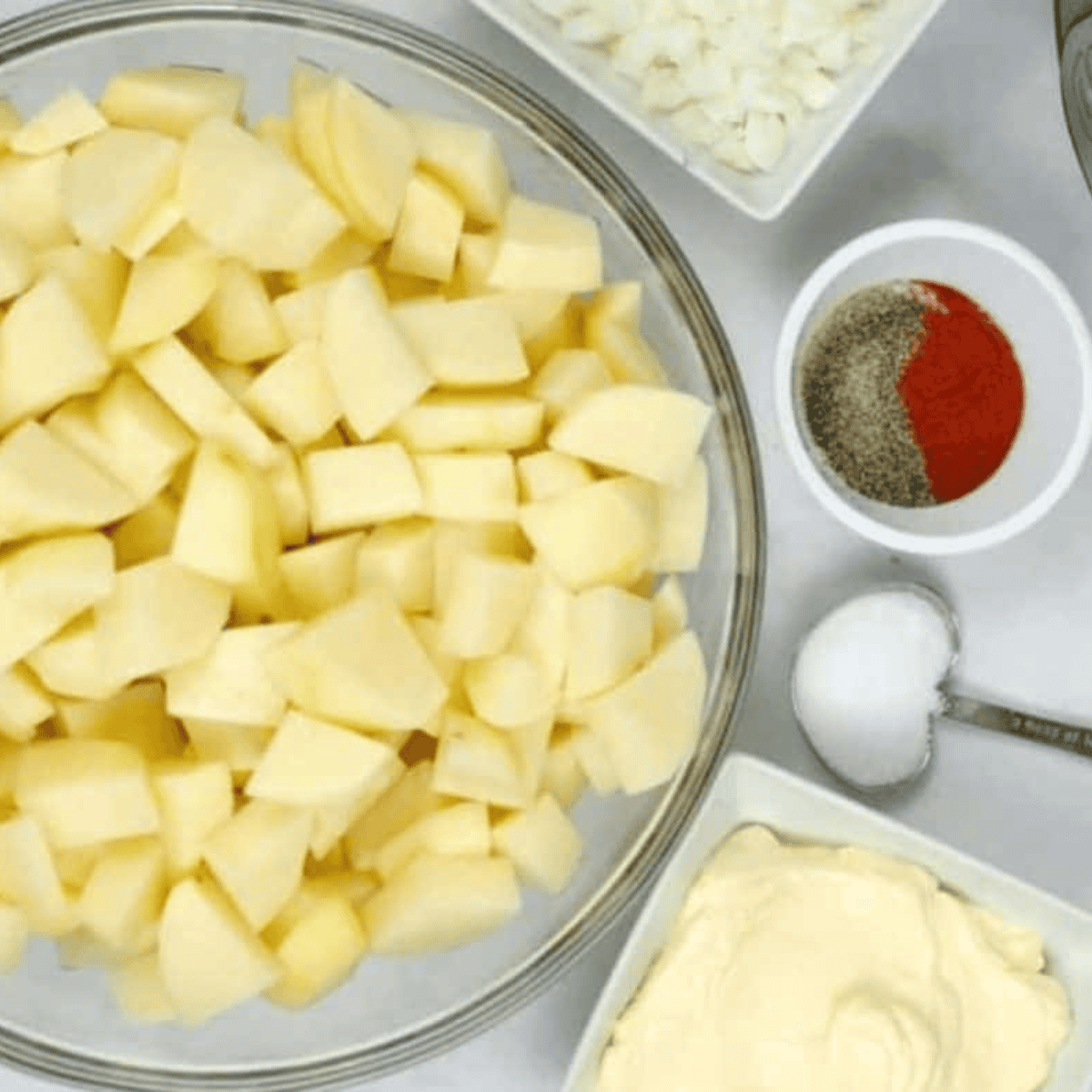 Ingredients needed for Hellmann’s Original Potato Salad on kitchen table.