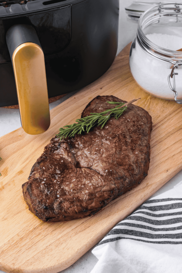 Perfect Air Fryer Sirloin Steak cooked to juicy, tender perfection with herb butter on top.