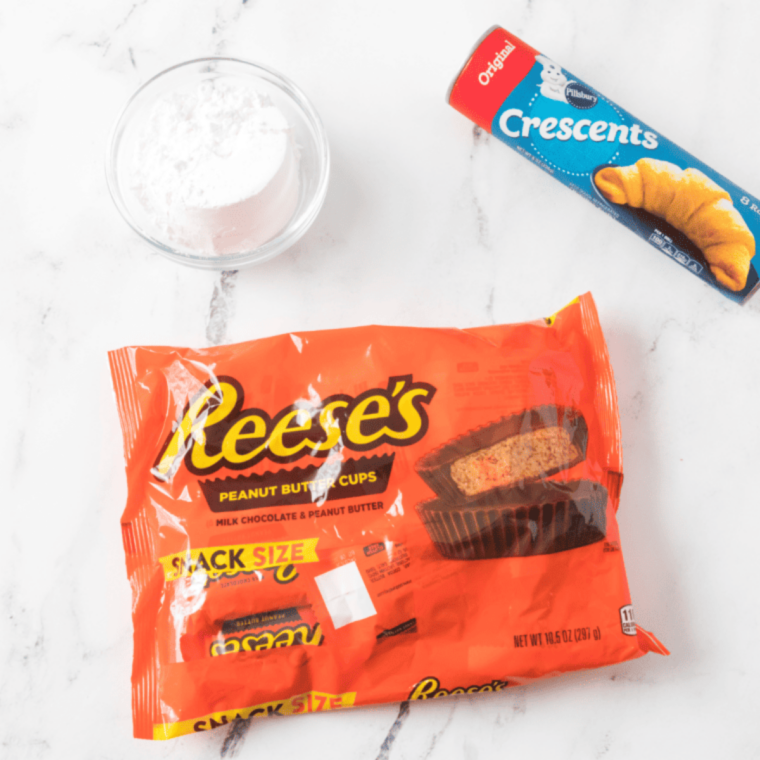 Ingredients needed for Air Fryer Reese’s Peanut Butter Cup Bombs — Gooey, Golden & Done in 8 Minutes on kitchen table.
