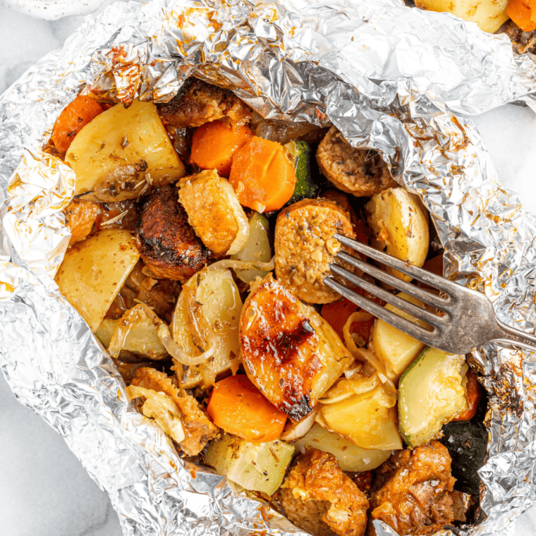 Air Fryer Beyond Sausage cooking to golden brown on a tray, ready to serve in a sandwich or bowl.