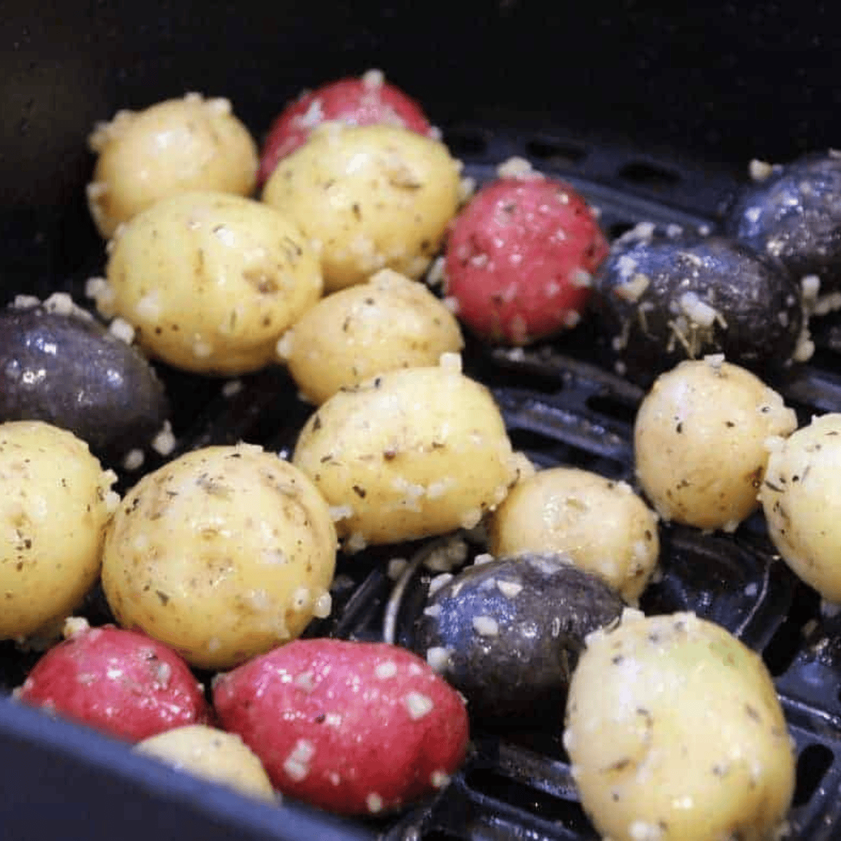 Air fryer preheated to 400°F with Trader Joe’s mini potatoes cooking in a single layer until crispy and fork-tender, shaken during cooking.