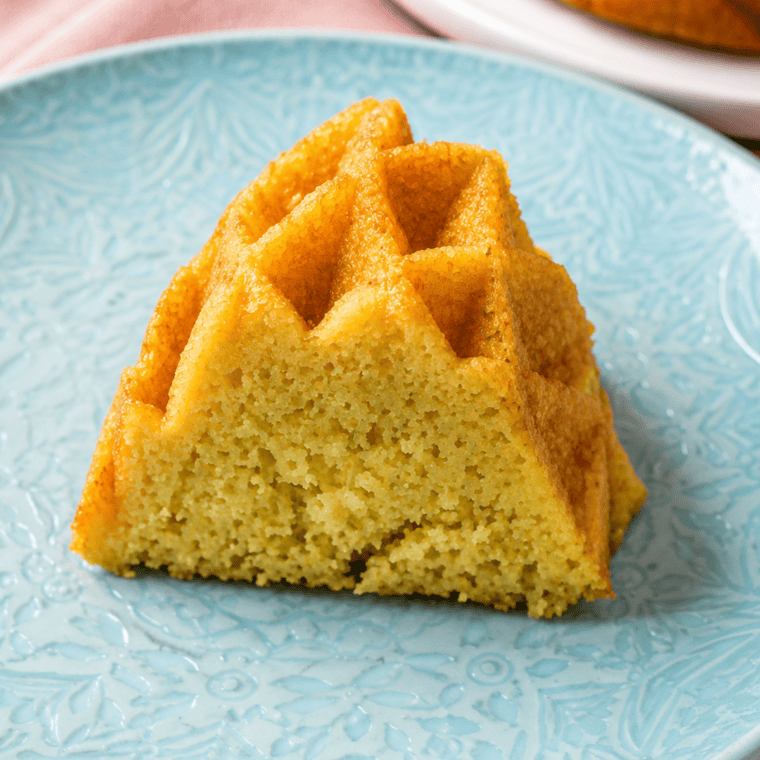 Air fryer 7-Up Bundt cake inverted onto a wire rack to cool before glazing