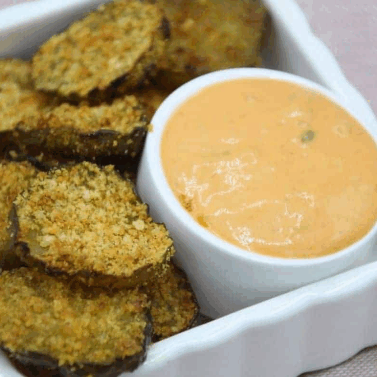 Crispy golden Air Fryer Shake and Bake Fried Pickles served on a plate, ready to eat.