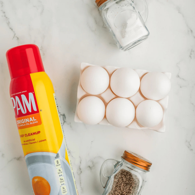 Ingredients for air fryer veggie egg bites: eggs, heavy cream, diced bell peppers, onion, cheddar and mozzarella