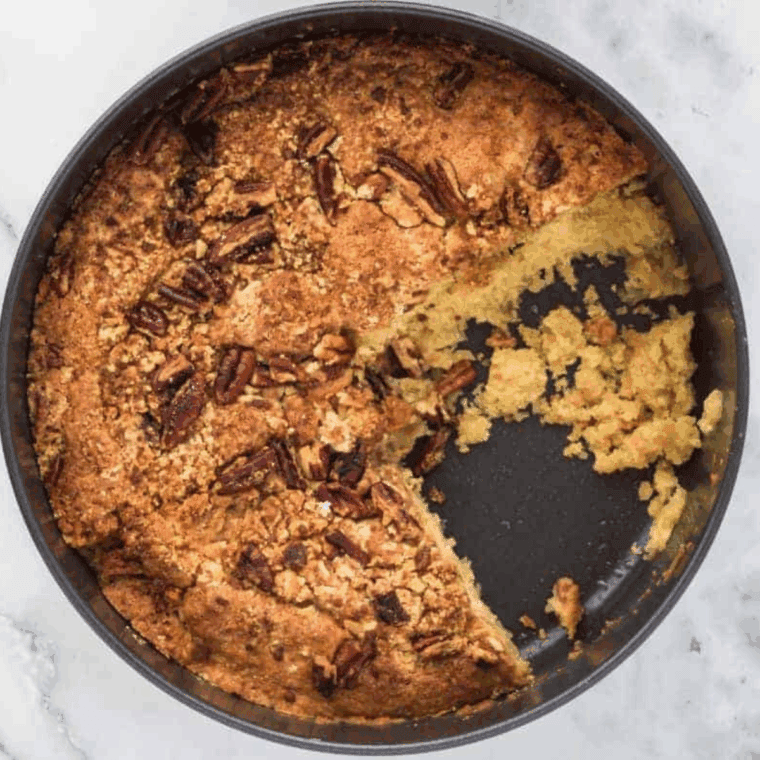 Ninja Foodi copycat Starbucks coffee cake with golden crumb topping, sliced on a plate.