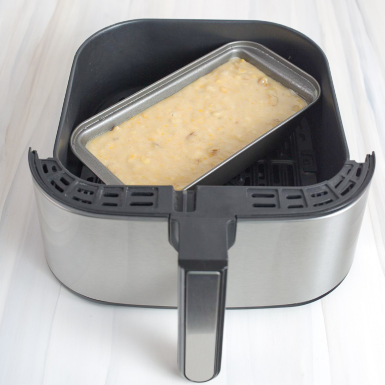 Comparison of basket-style and oven-style air fryers on kitchen counter
