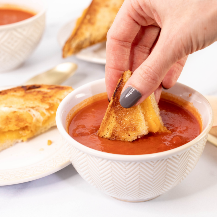 Golden brown grilled cheese sandwich in a Ninja Crispi basket ready to serve
