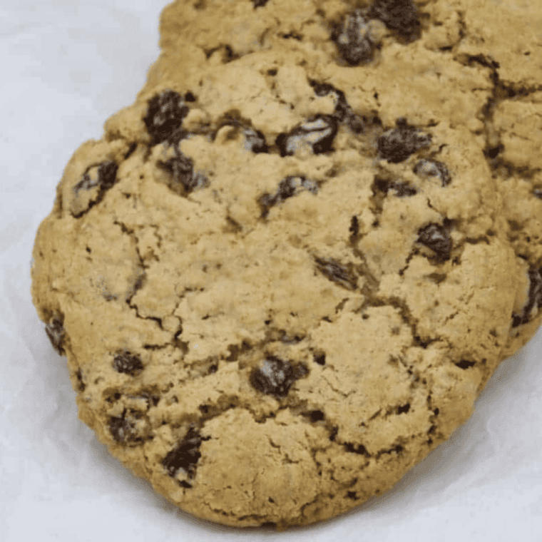 Freshly baked Subway-style oatmeal raisin cookies with plump raisins and a chewy texture.