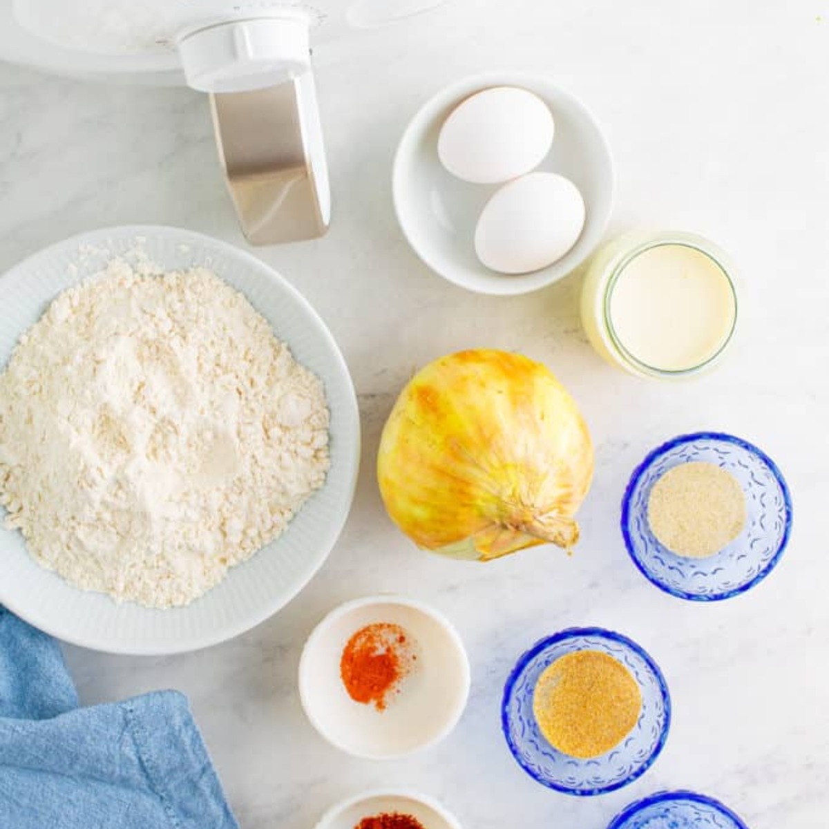 Ingredients for Outback bloomin' onion sauce including mayonnaise, ketchup, horseradish, and spices laid out on a counter