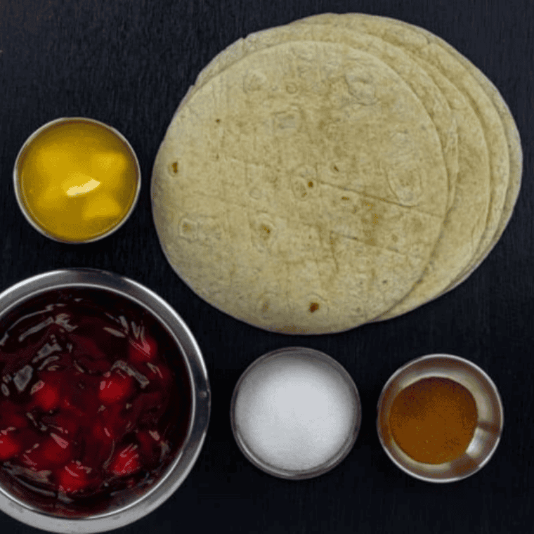 Ingredients for air fryer cherry chimichangas including cherry pie filling, flour tortillas, sugar, cinnamon, and butter