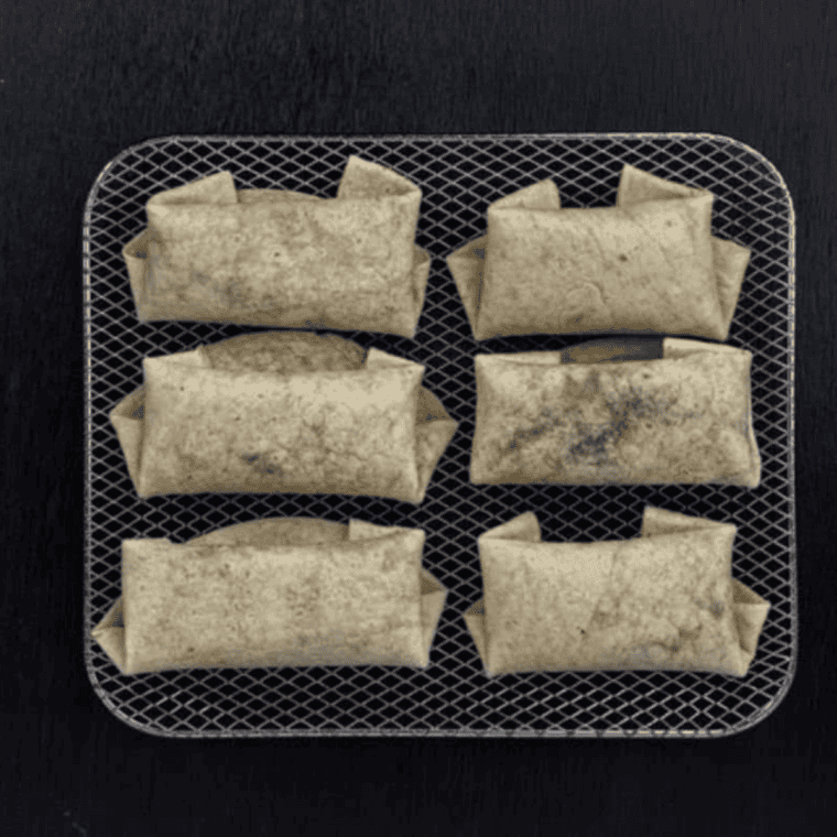 Air-fried cherry chimichangas brushed with butter and sprinkled with cinnamon sugar