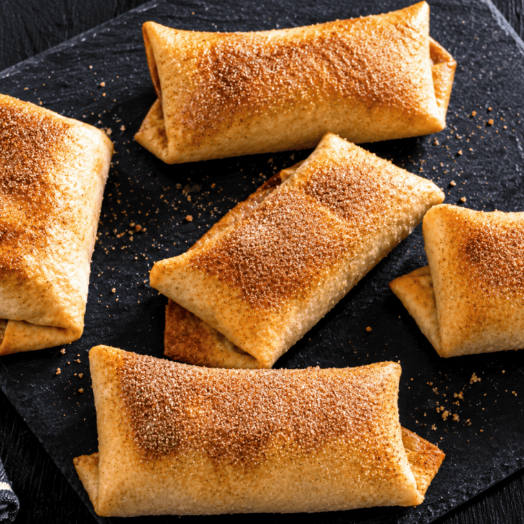 Close-up of a cherry chimichanga cut open showing the cherry pie filling inside