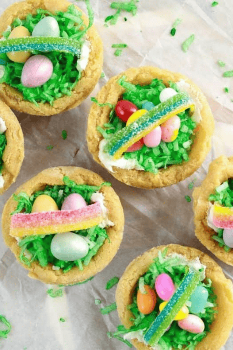 Air fryer Easter basket cookie cups filled with colorful Easter candy.
