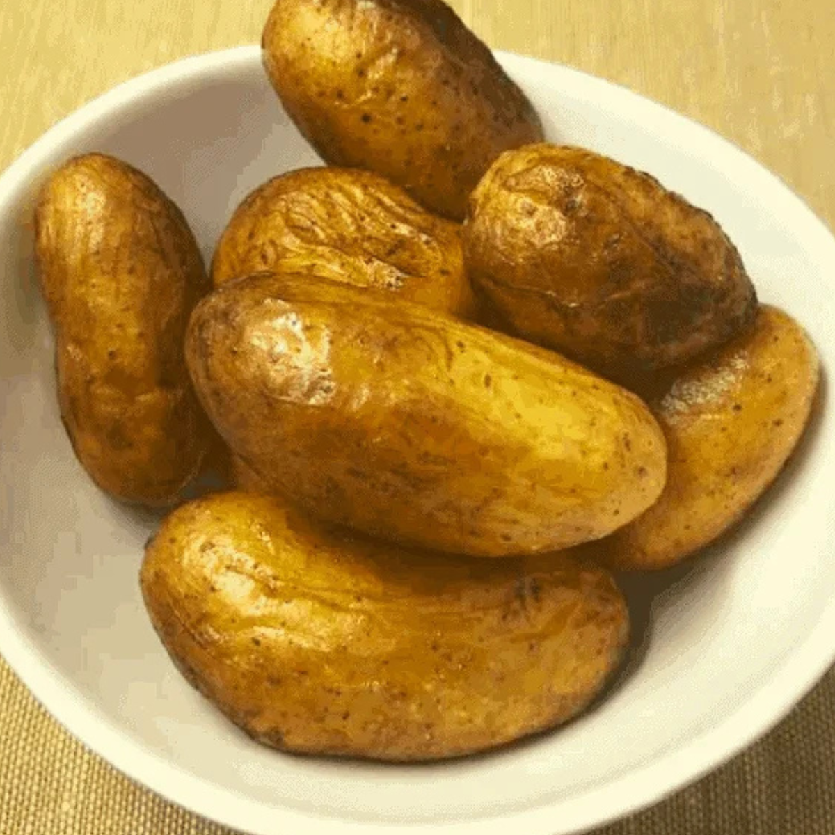 Ingredients for air fryer fingerling potatoes: whole fingerlings, olive oil, kosher salt, and black pepper