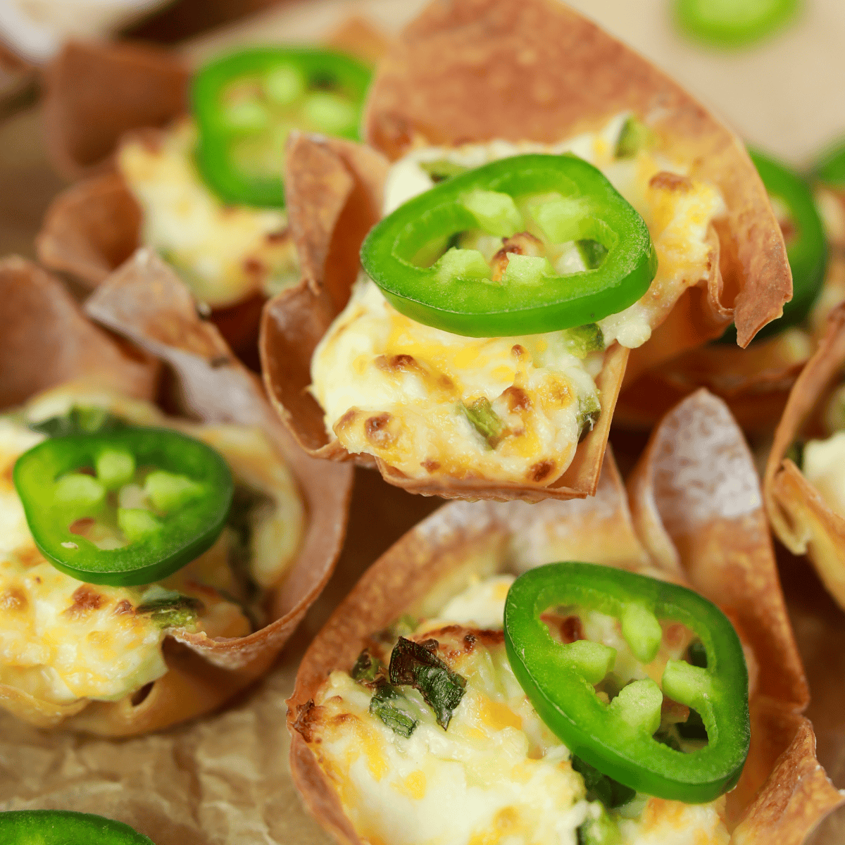 Jalapeno popper wonton cups topped with fresh sliced jalapenos