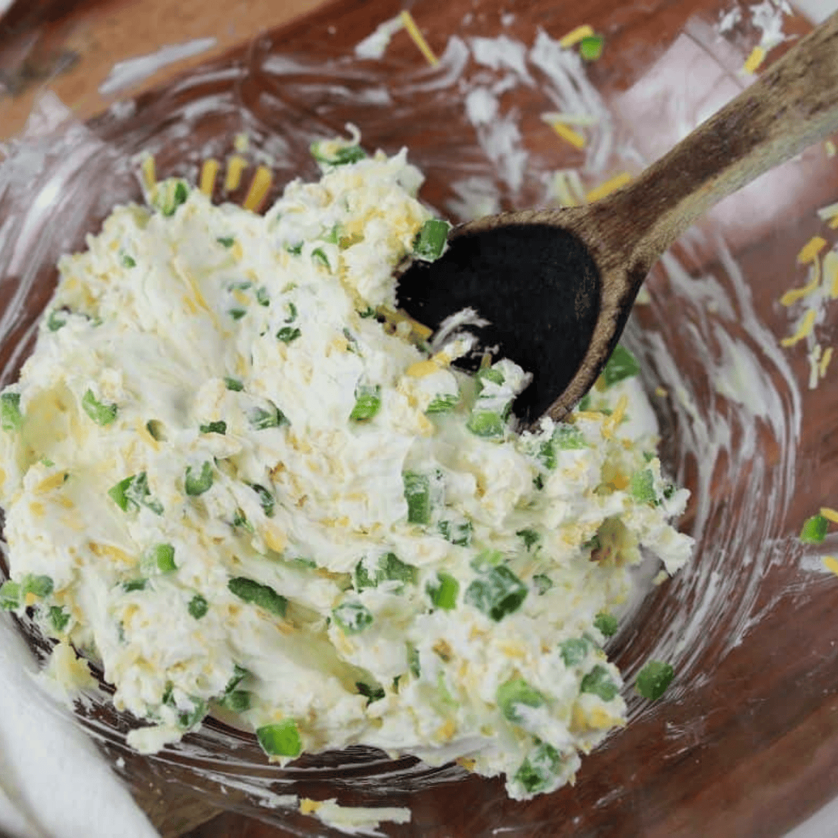 Creamy jalapeno popper filling mixed together in a glass bowl