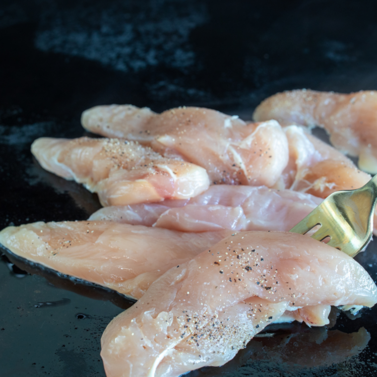 Chicken tenders tossed with olive oil and seasoned with salt and pepper before griddling.