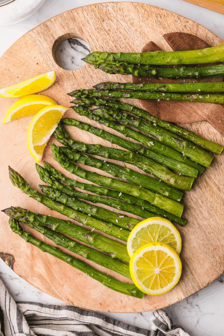Frozen asparagus cooking in an air fryer, crispy and ready to serve.