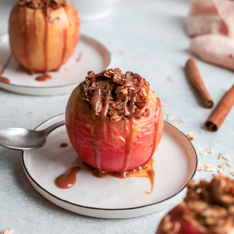 Air fryer baked apples in a dish topped with cinnamon and a light glaze, warm and tender dessert served straight from the air fryer.