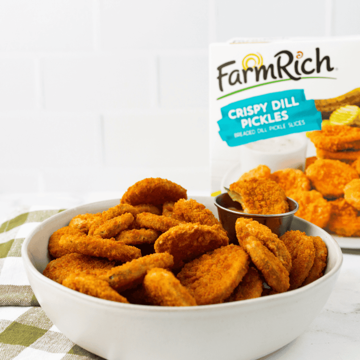 Frozen pickle spears cooked in the air fryer until golden and crispy, ready to serve as a snack or appetizer.