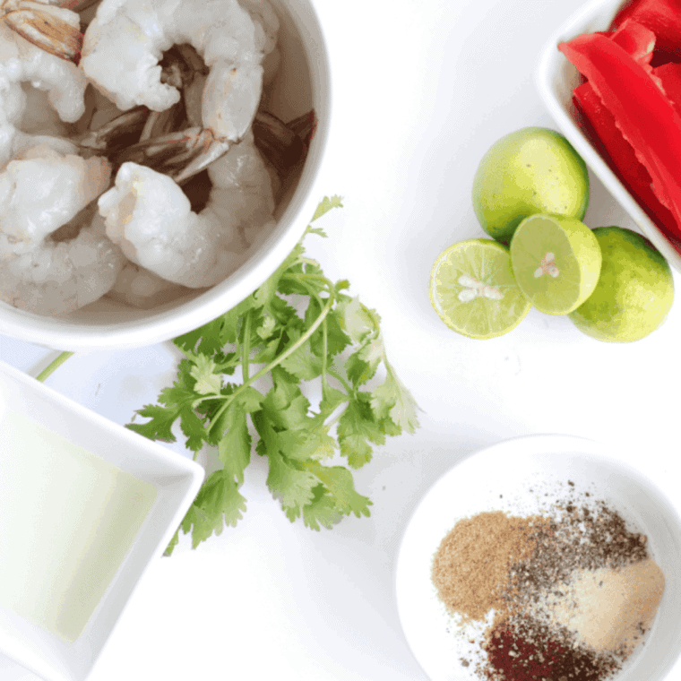 Ingredients needed for Easy Air Fryer Shrimp Fajitas on kitchen table.