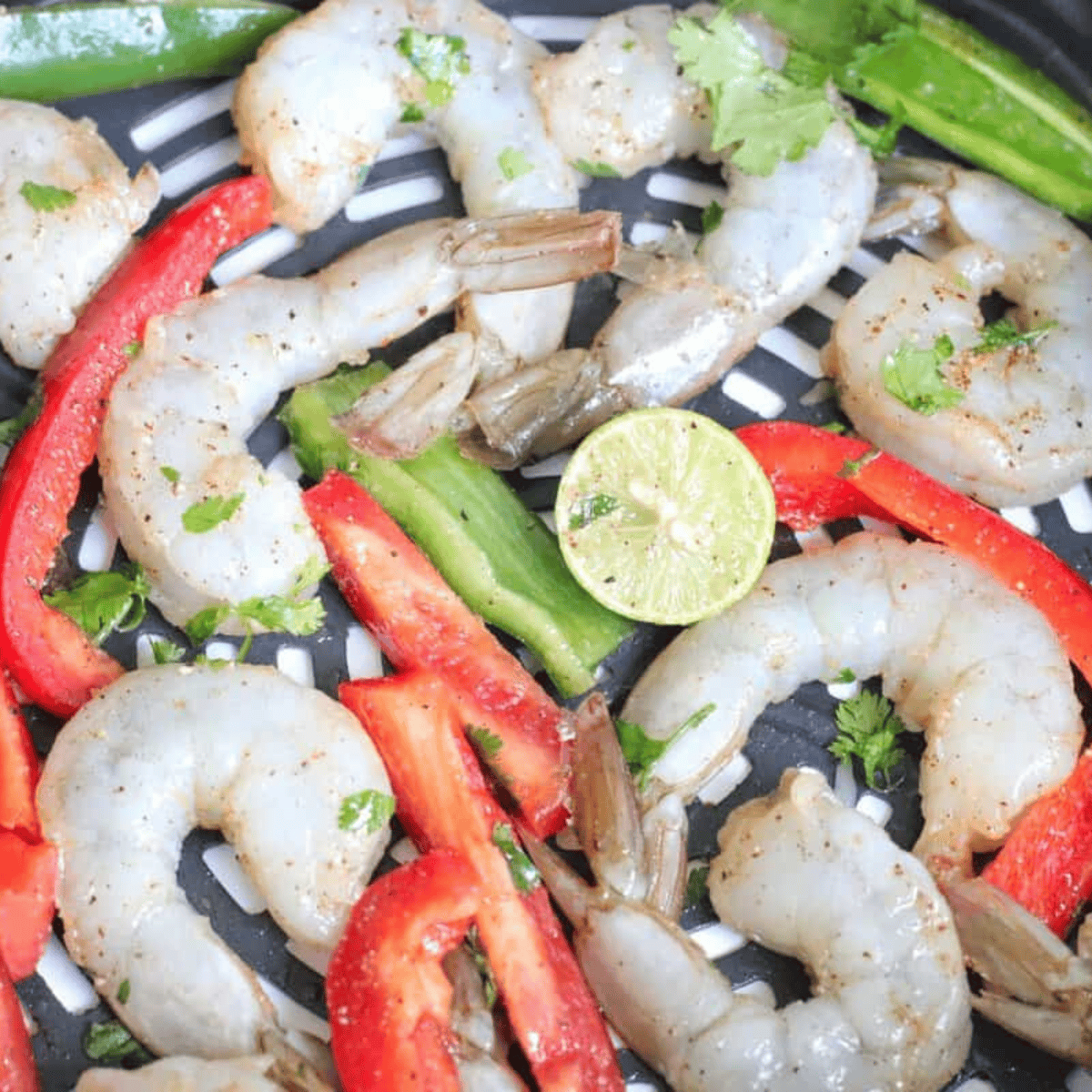Golden, air-fried shrimp with peppers straight from the air fryer.